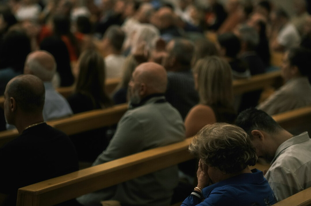 Audience listening attentively at a conference lecture hall